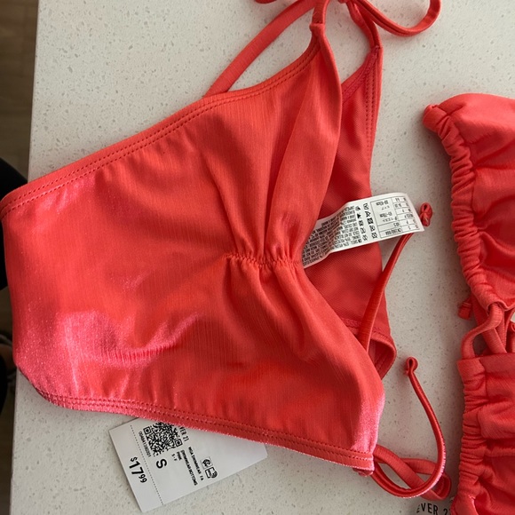 Satin pink sparkly 2 piece bathing suit with a matching cover-up skirt. - Picture 4 of 4